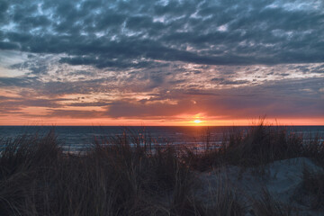 sunset and dunes at the coast. High quality photo