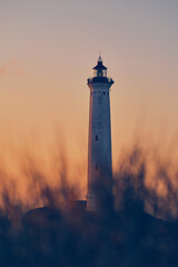 Lighthouse in the dunes at the danish coast. High quality photo - obrazy, fototapety, plakaty