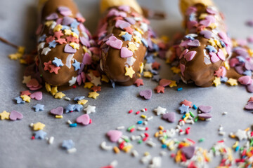 banana with chocolate and sprinkles close up