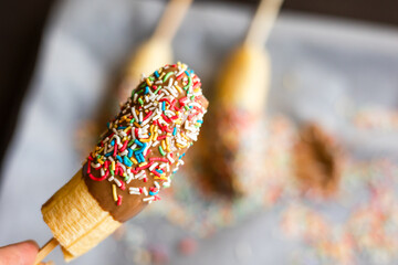 banana with chocolate and sprinkles close up
