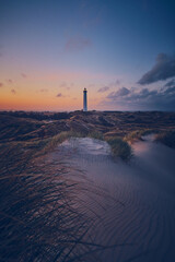 white sands and Lighthouse in the dunes of the danish north sea coast. High quality photo - obrazy, fototapety, plakaty