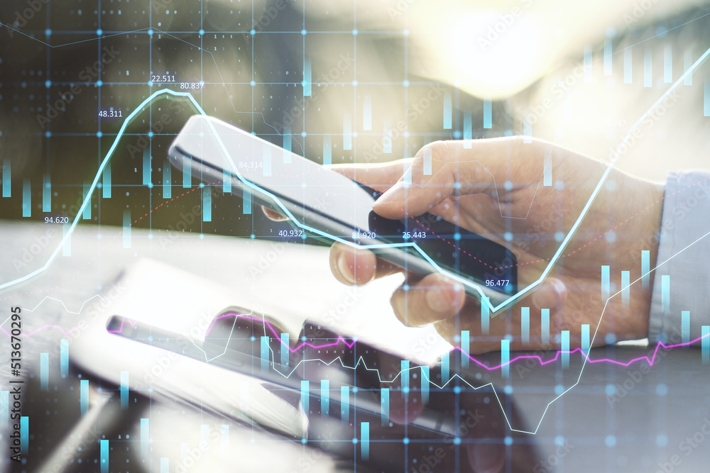 Poster Close up of hands using tablet and smartphone at desktop with abstract glowing forex graph on blurry outdoor background with candlestick. Invest, trade and broker concept. Double exposure.