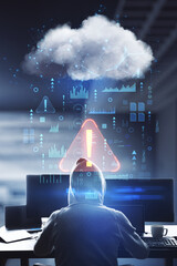 Warning and cyber security concept with back view on hacker in hoody using computers and abstract...