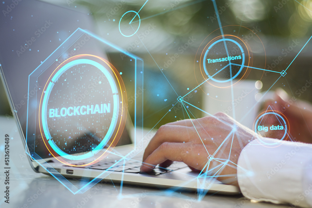 Poster Close up of hands using laptop keyboard on desktop with coffee cup and creative polygonal blockchain hologram and blurry outdoor background. Technology and fintech concept. Double exposure.