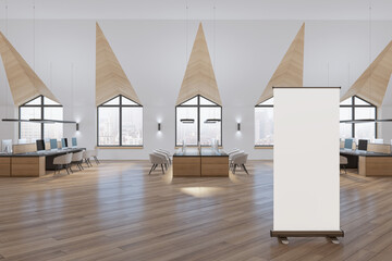 Modern spacious wooden and concrete coworking office interior with blank white roll up banner, windows and city view, furniture and equipment. Workplace concept. Mock up, 3D Rendering.