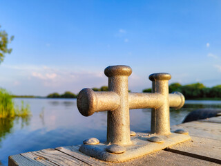 River bollard. Berth. River buildings. Coast.