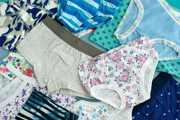 Clothing in the form of children's underwear. Lots of panties and t-shirts for girls and boys. Soft underwear for children.