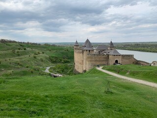 Fototapeta na wymiar old castle on the river hills. Khotyn Ukraine.