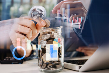 businessman holding coins putting in glass. concept saving money for finance accounting