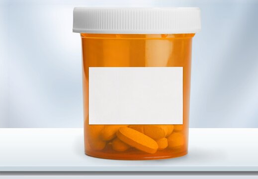 Medical vial with pills and empty label without text. Plastic Prescription.