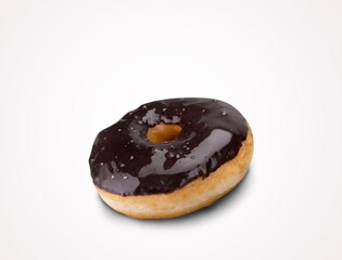Tasty sweet chocolate glazed donut with crumbs and creme filled