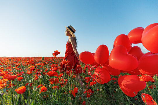 Happy woman holding balloons in nature. High quality photo - Powered by Adobe