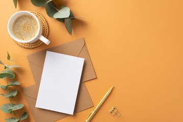 Business concept. Top view photo of workspace paper sheet over craft paper envelopes gold pen cup...