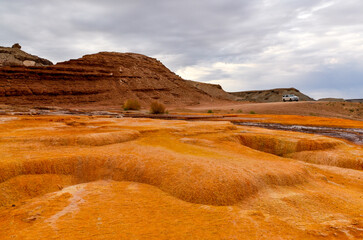 yellow and orange flowstone around Crystal Geyser (Green River, Utah, USA)