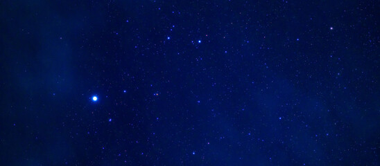 Panorama of the night starry sky with many stars on a dark blue background