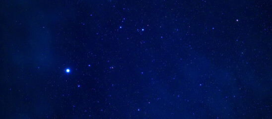 Panorama of the night starry sky with many stars on a dark blue background © alexkoral