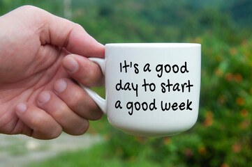It is a good day to start a good week text on coffee cup.