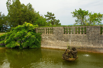 Fototapeta premium The pond in the Ferrari Garden in Stanjel village in Komen municipality, Primorska region, western Slovenia 