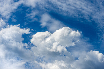 Photography of beautiful storm clouds, cumulus clouds or cumulonimbus against a clear blue sky. Full frame, sky only.