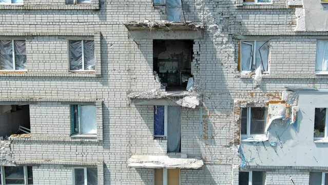 Chernihiv, Ukraine - June 27, 2022: War in Ukraine. Damaged ruined multi-storey house in ukrainian city Chernihiv near Kyiv on north of Ukraine. Ruins during War of Russia against Ukraine.