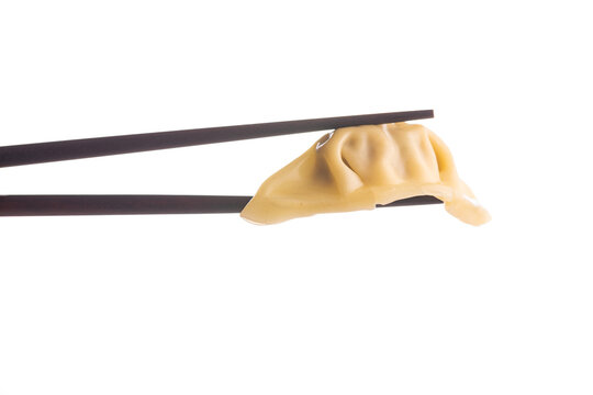 Chinese dumplings and chopsticks isolated on white background.