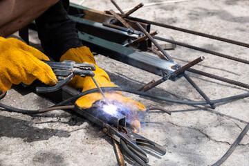 Welding work outdoors in a private house close-up.