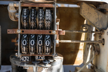 A counter of an old and abandoned petrol pump. numbers on the counter.