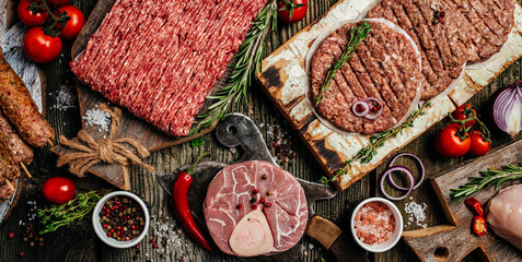 Raw meat products, different parts of the body. minced beef meat kebabs, pork, beef, chicken on a...
