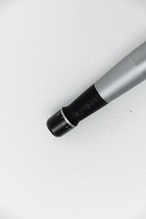 Manipulas for hardware procedures. Electric pen for derma stamp. Dermapen. Needle mesotherapy procedure. Professional skin care in the salon, medical procedure.  Acne treatment.