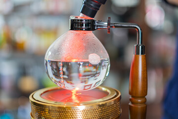 Making coffee with syphon method