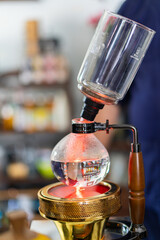 Making coffee with syphon method