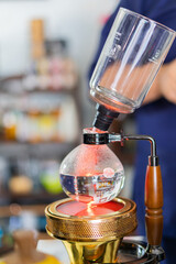 Making coffee with syphon method