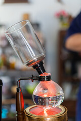Making coffee with syphon method