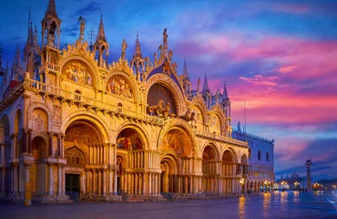 Fotobehang Venice, Italy. Basilica of Saint Mark and Clocktower on Piazza San Marco square. Evening cityscape with street Lamps illumination. Famous Landmark in Venice, basilica di san marco Scenic sunset view. © Yasonya