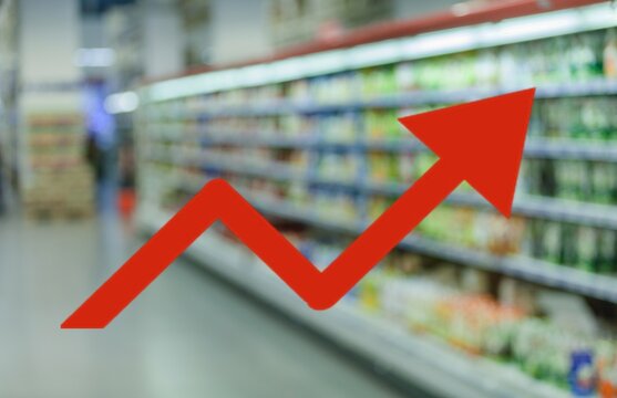 Red up arrow on blur image of supermarket background. Charts and graphs. Stock Market. Shop