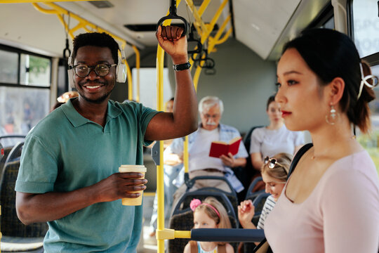 African American Man Having Coffee In Bus