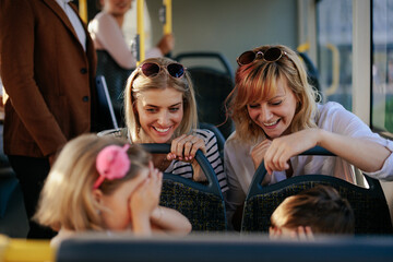 Mothers and children traveling by bus