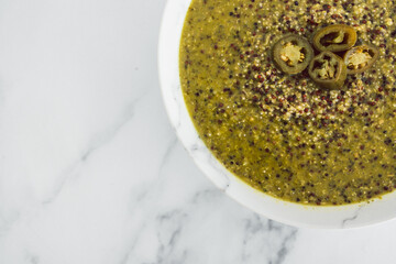 healthy plant-based food, vegan pesto quinoa with spicy jalapeno peppers