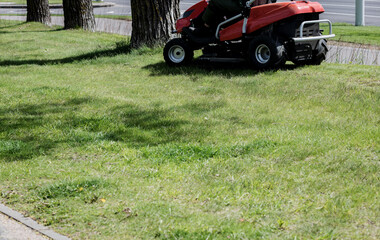 Red Lawn mower cutting grass