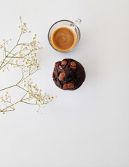 cup of coffee, and chocolate  muffin on white background