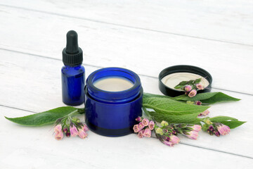 Comfrey herb ointment and essential oil used in natural herbal plant medicine to treat skin problems including burns, swelling, sprains,  bruises. Is anti inflammatory and treats arthritis and gout. 