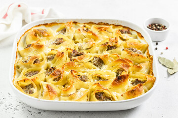 Buffalo chicken stuffed conchiglioni pasta shells. Space for text.