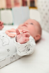 baby hand close-up. cute newborn baby at home