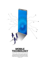 businessman and businesswoman walking to big mobile phone. Business Concept of mobile technology with business.