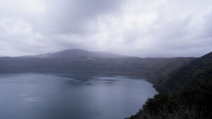 Scenic View Of Lake Against Sky During Foggy Weather