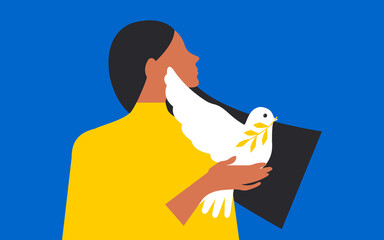 A cute girl with long black hair holds a white dove of peace in her hands on a horizontal blue background. 
