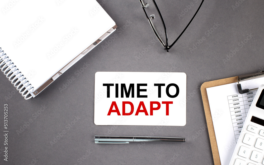 Poster time to adapt text written on the card with notebook and clipboard, grey background
