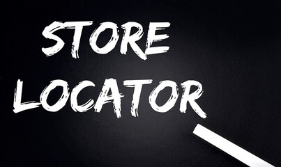 STORE LOCATOR Text on Black Chalkboard with a piece of chalk