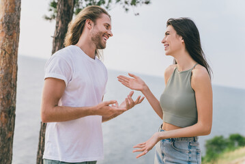 Obraz premium Profile side photo of lovely newlywed couple enjoy their honeymoon near lake river tropical island talking express their love