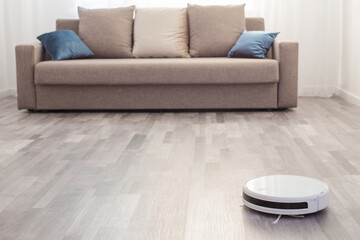 robot vacuum cleaner on the floor in  living room